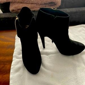 Ankle boots with side zippers.  Never worn